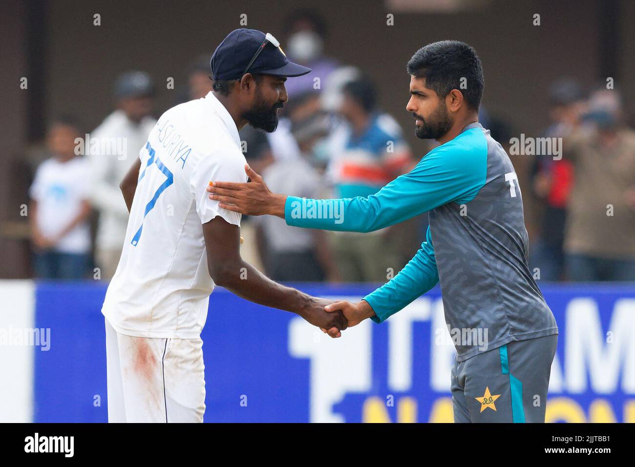 Galle, Sri Lanka. 28th July 2022. Sri Lanka bowler Prabath Jayasuriya is being congratulated by Pakistan captain Babar Azam for taking five wickets during the 5th day of the 2nd test cricket match between Sri Lanka vs Pakistan at the Galle International Cricket Stadium in Galle on 28th July, 2022. Viraj Kothalwala/Alamy Live News Stock Photo