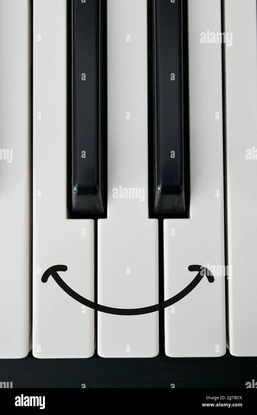 Abstract Shot Of Piano Keyboard and Draw Happy Smile Stock Photo