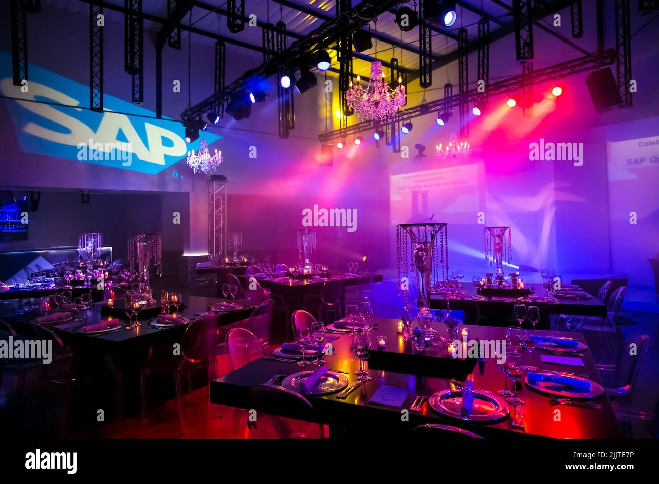 An interior and decor set up for a corporate gala dinner event in