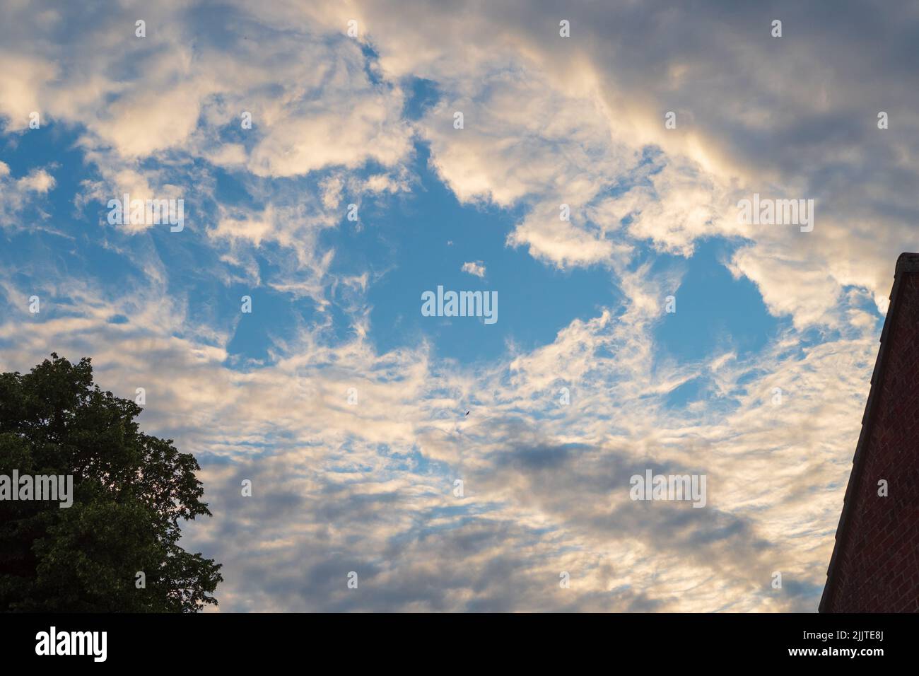Altocumulus and cumulus clouds, UK Stock Photo