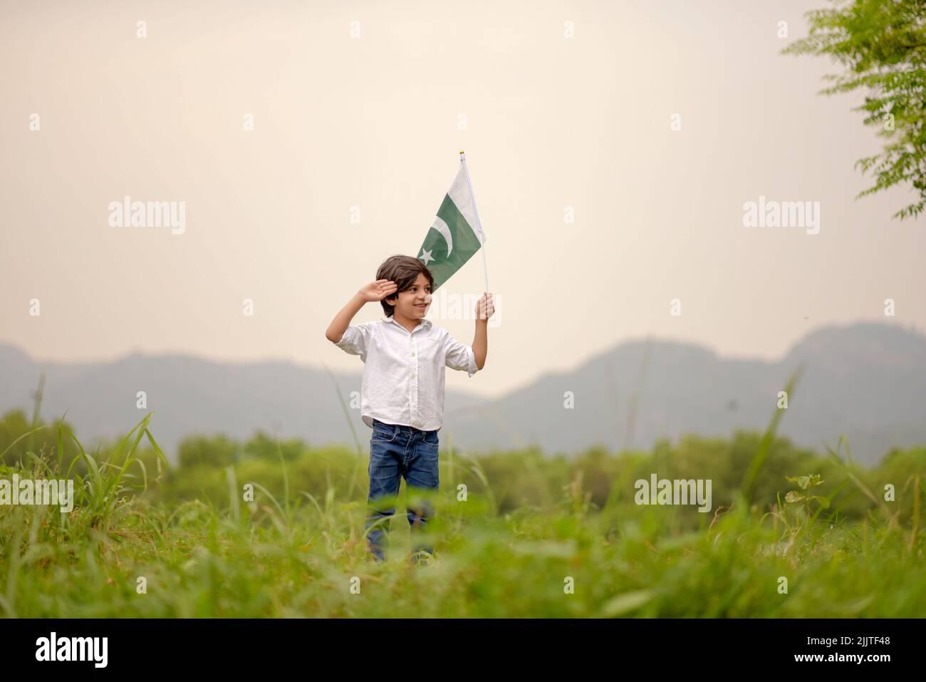PakistanI boy child holding Pakistan flag, F-9 Park, Islamabad, Pakistan. Stock Photo