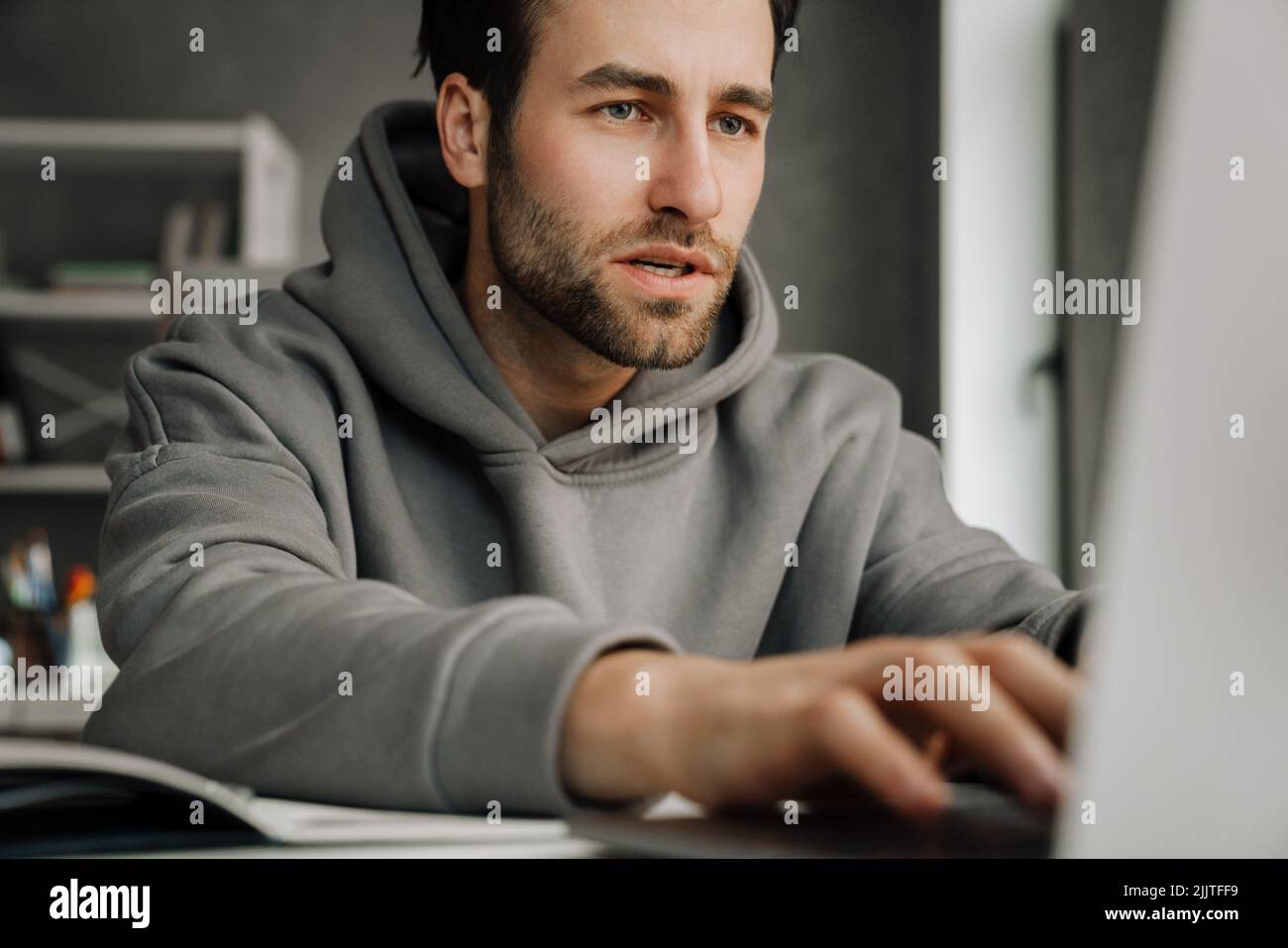 Young man beard desk hi-res stock photography and images - Alamy