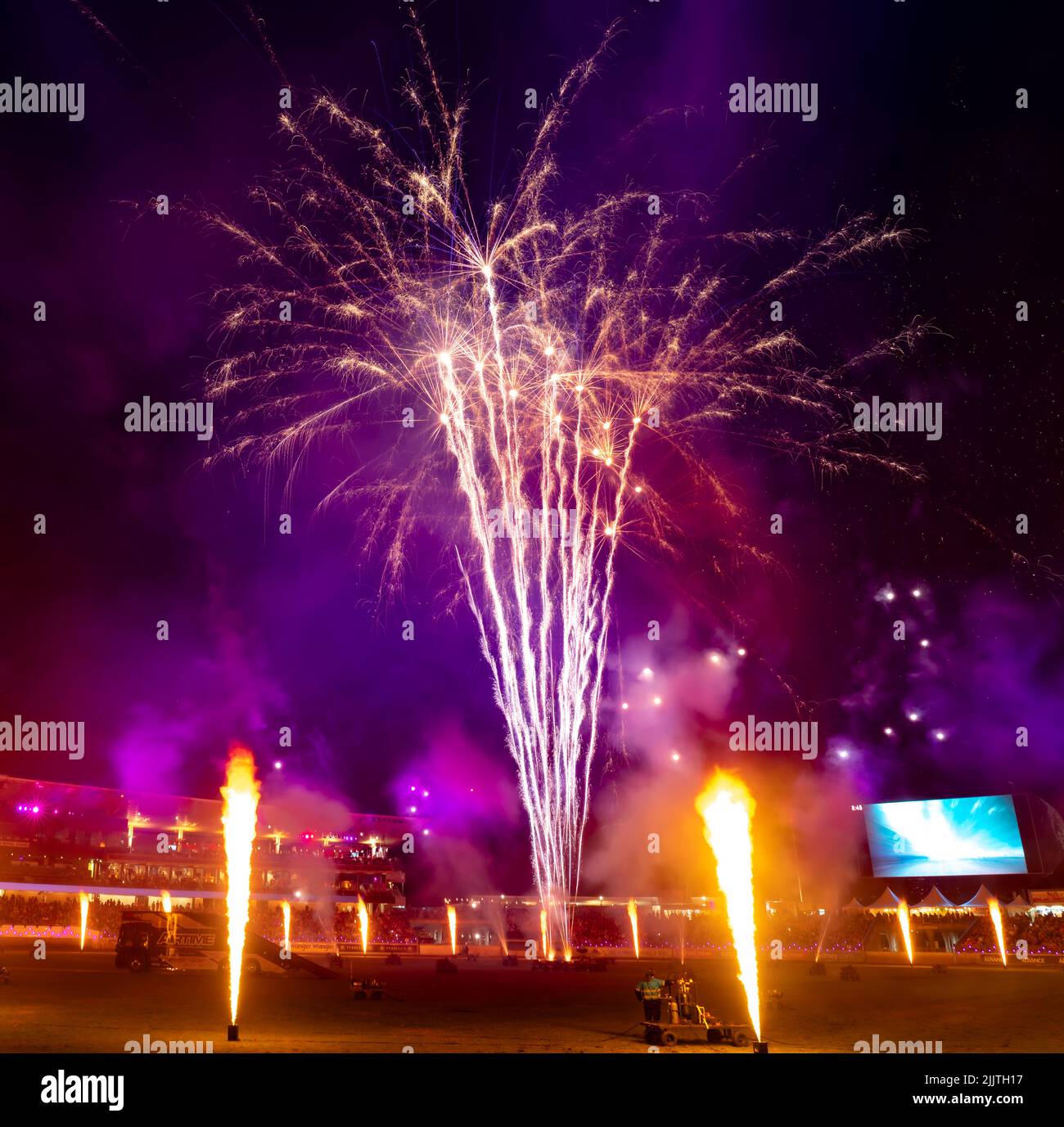 The display of colorful fireworks against the dark sky background in Sydney Olympic Park Stock Photo