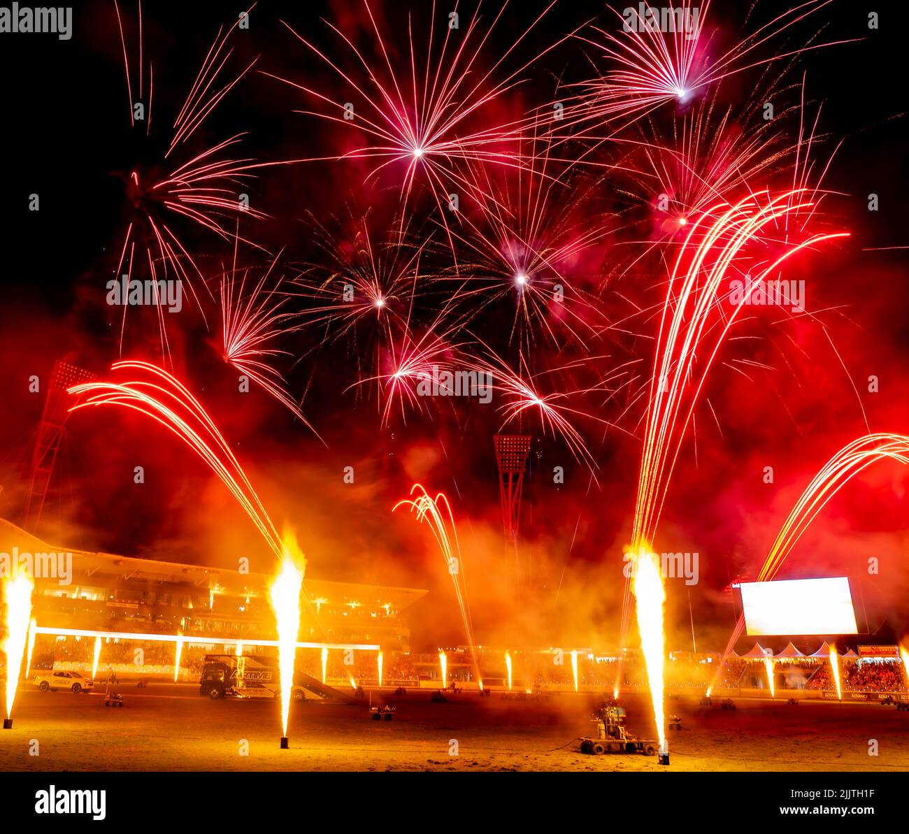 The display of colorful fireworks against the dark sky background in Sydney Olympic Park Stock Photo