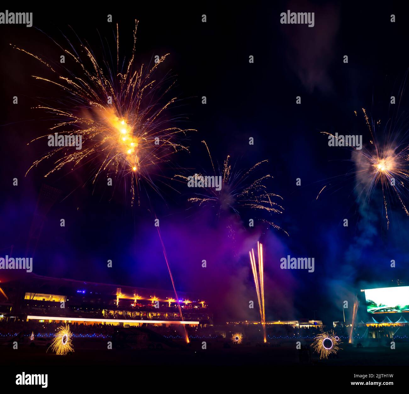 The display of colorful fireworks against the dark sky background in Sydney Olympic Park Stock Photo
