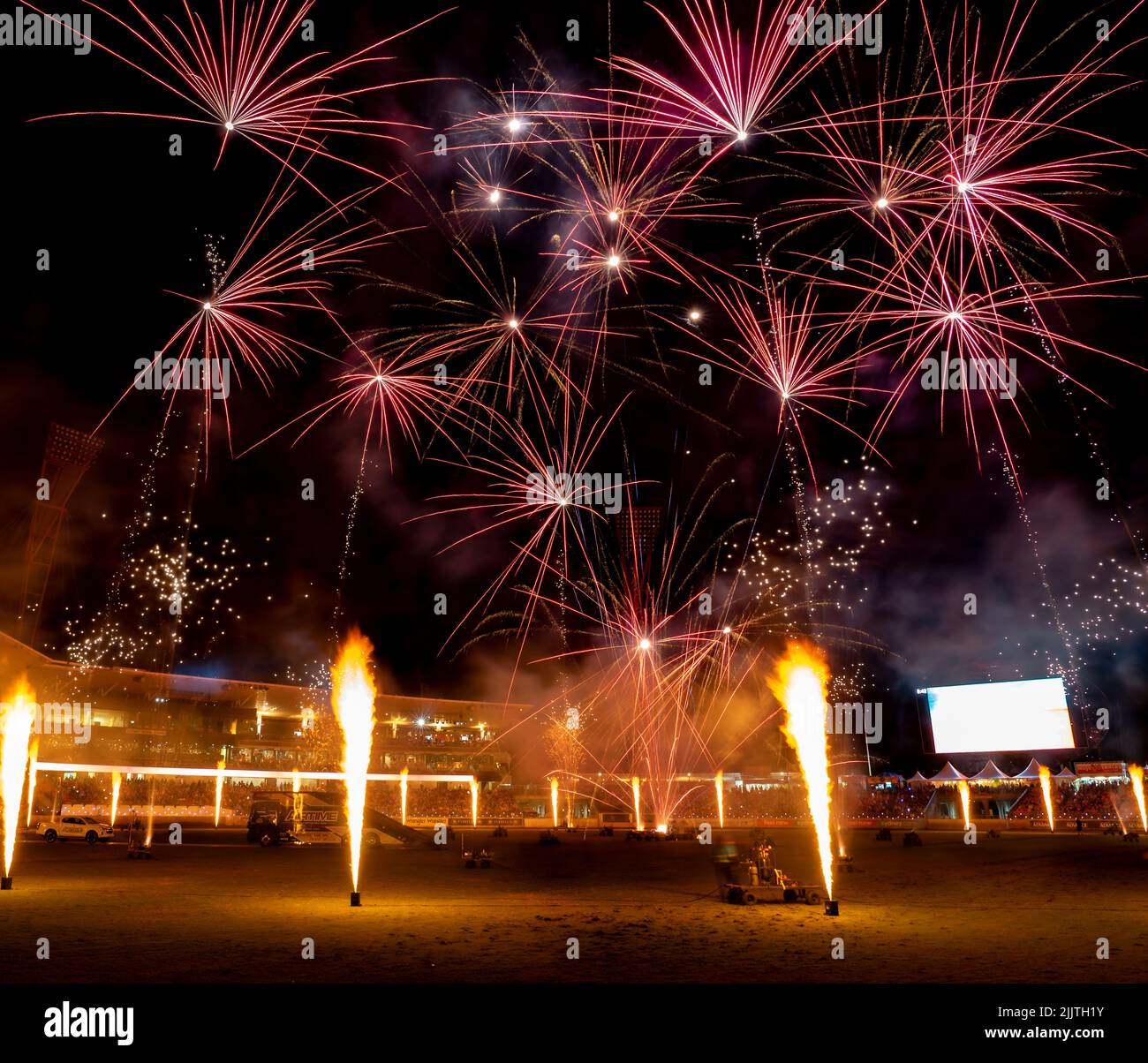 The display of colorful fireworks against the dark sky background in Sydney Olympic Park Stock Photo