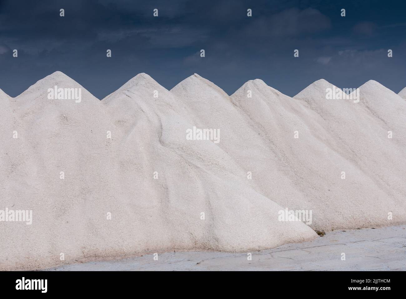 hills of naturally produced sea salt in a seawater saline Stock Photo