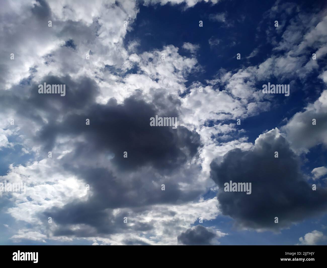Realistic white fluffy clouds hi-res stock photography and images - Alamy