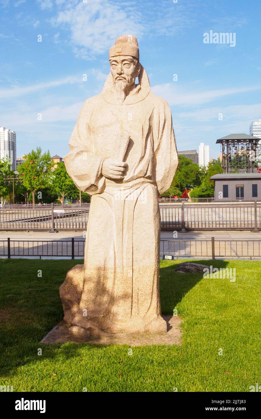Xi'An, China - June 5, 2022: Stone sculpture of a Chinese historic personality in a public park. The area is a famous place and tourist attraction. Stock Photo