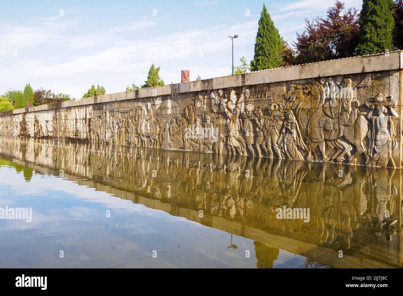 Xi'An, China - June 5, 2022: A giant sculpture wall by the water. The famous place is a tourist attraction. Stock Photo