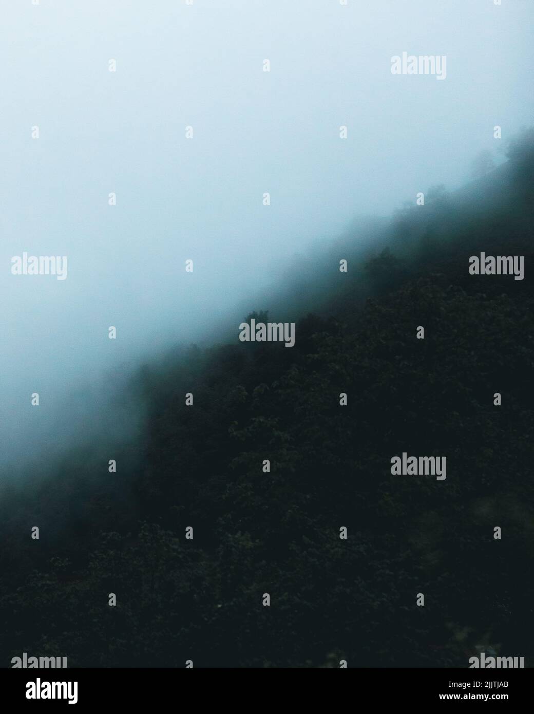 A gloomy foggy day in the mountains Stock Photo