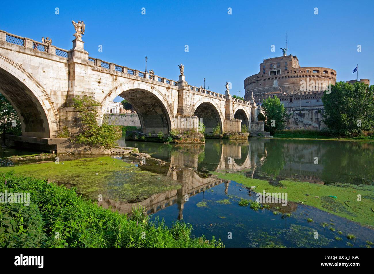 Sant'Angelo Bridge and Mausoleum of Hadrian with Tiber river during drought (July 2022), Rome, Italy Stock Photo