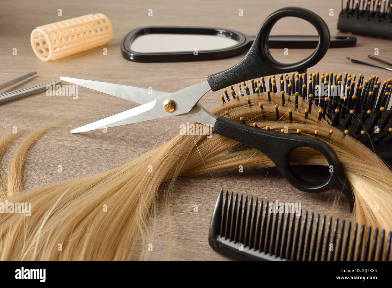 Hair cutting equipment with land detail with hairdressing tools around. Elevated view. Horizontal composition. Stock Photo