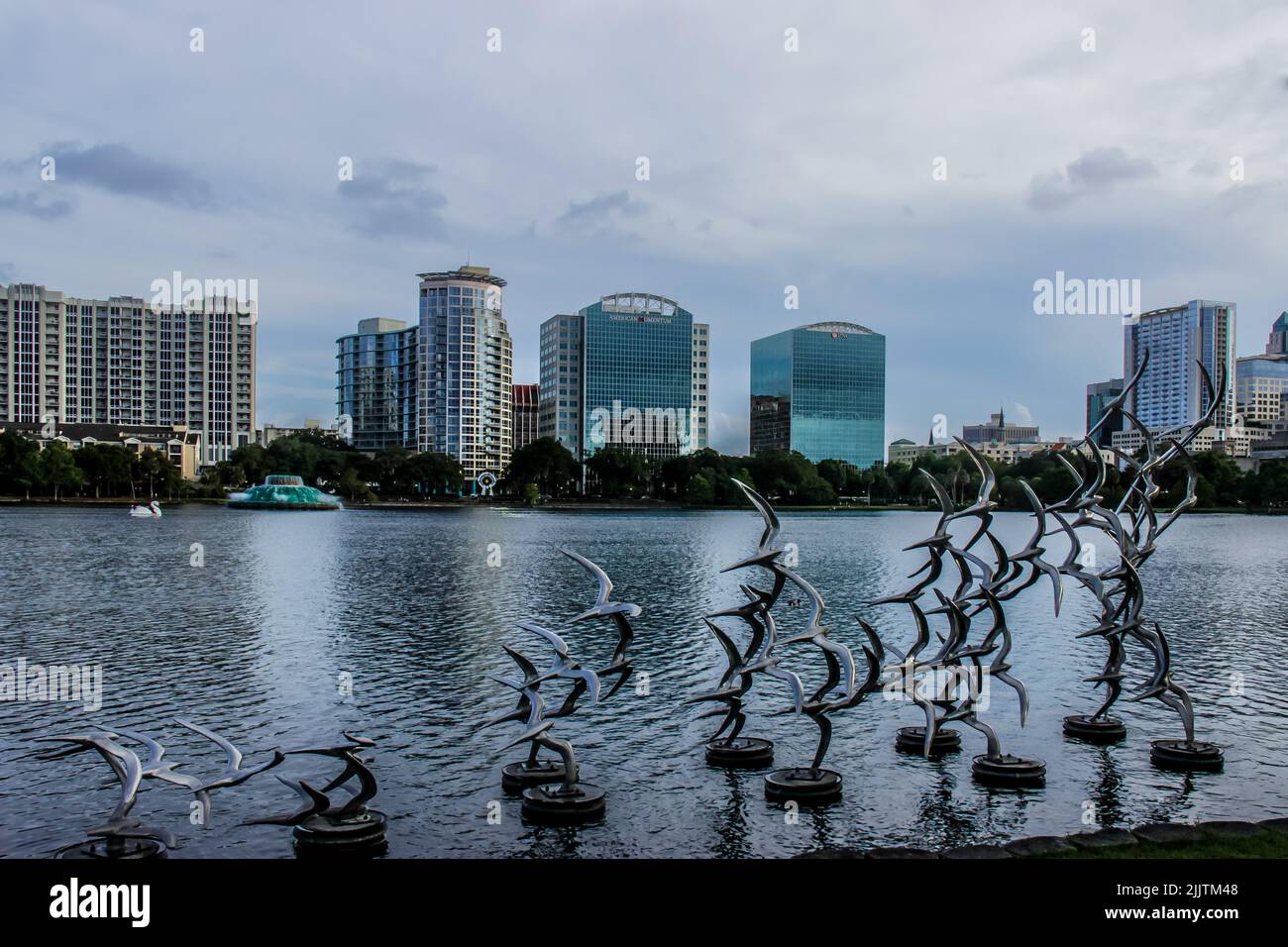 A sculpture of a flock of birds taking off in the Lake Eola in Orlando, Florida Stock Photo