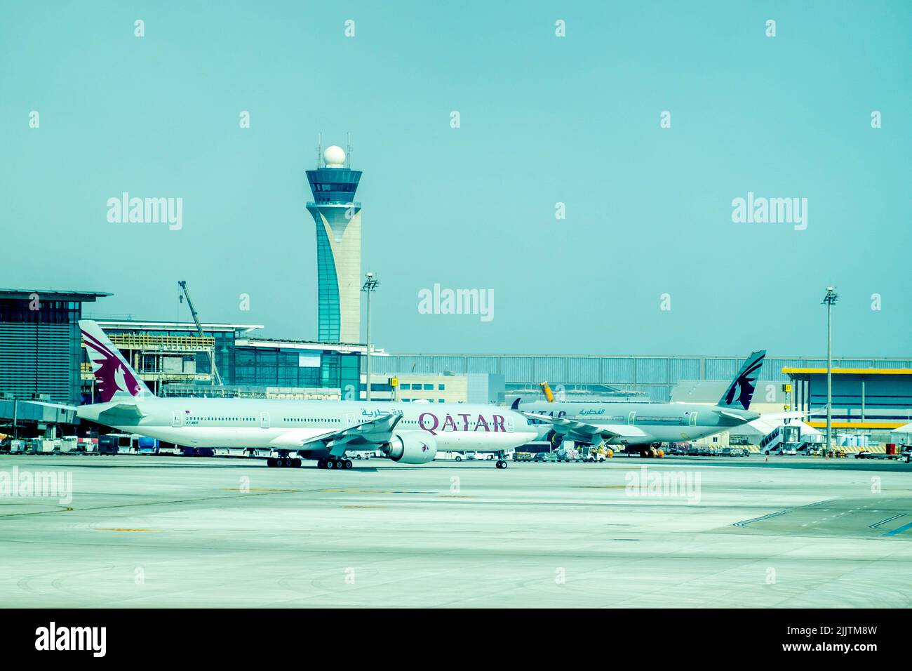 A Fly Dubai plane sitting at Hamad International Airport Stock Photo