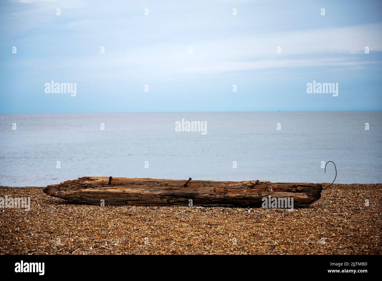 !40-year old wooden groyne or breakwater washed up on the beach due to coastal erosion, Bawdsey Ferry, Suffolk, UK. Stock Photo