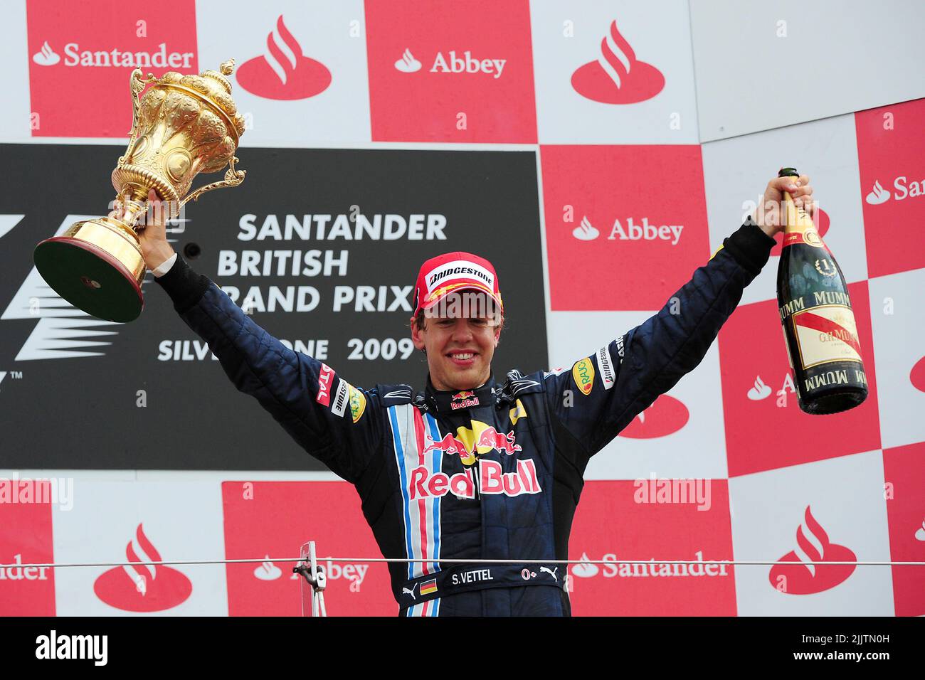 File photo dated 21-06-2009 of Red Bull Racing's Sebastian Vettel celebrates with the trophy after the British Grand Prix. Four-time world champion Sebastian Vettel has announced he will retire from Formula One at the end of the season. Issue date: Thursday July 28, 2022. Stock Photo
