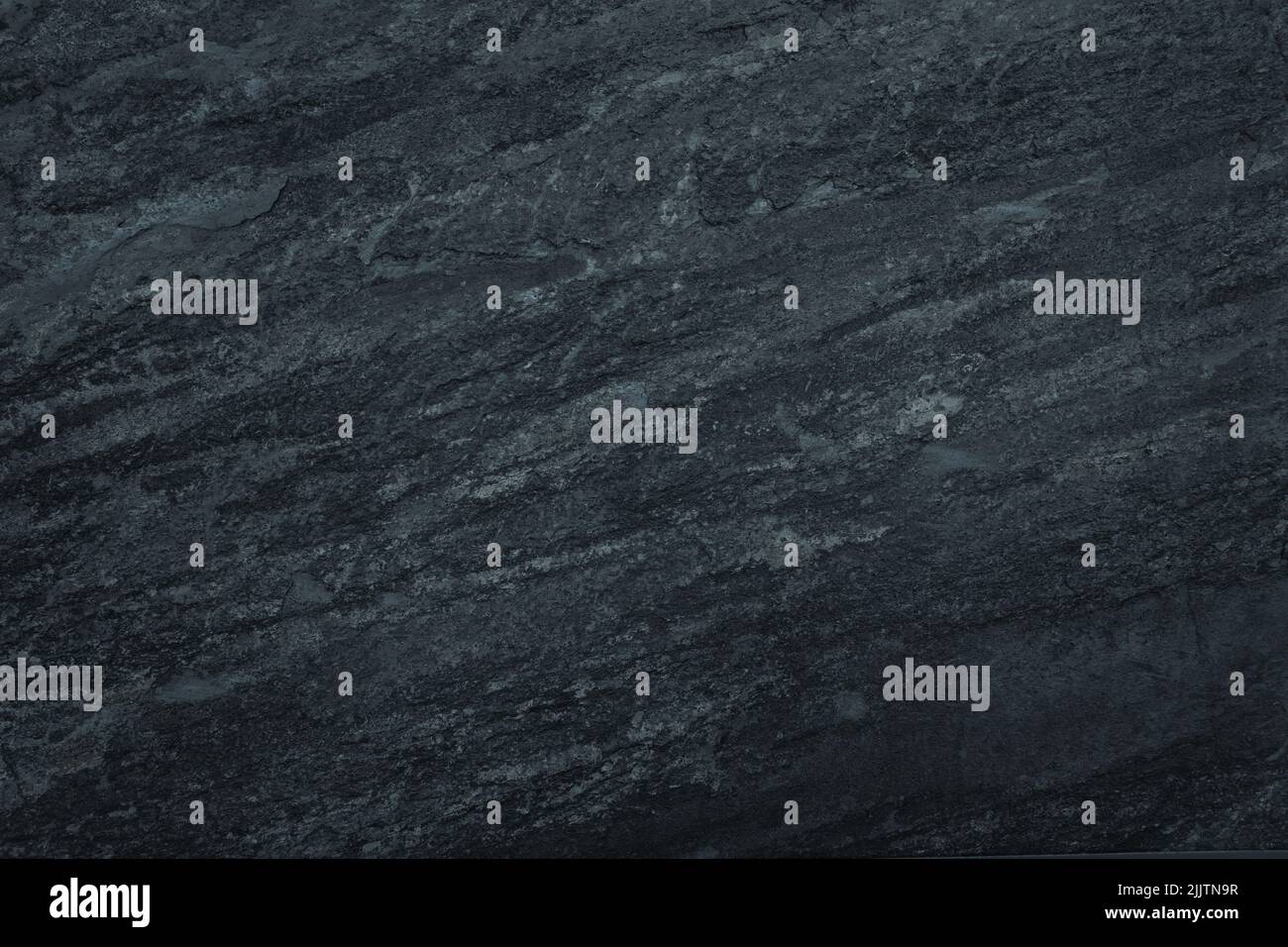 Gloomy black surface background. Abstract grunge rough peeled painted texture Stock Photo