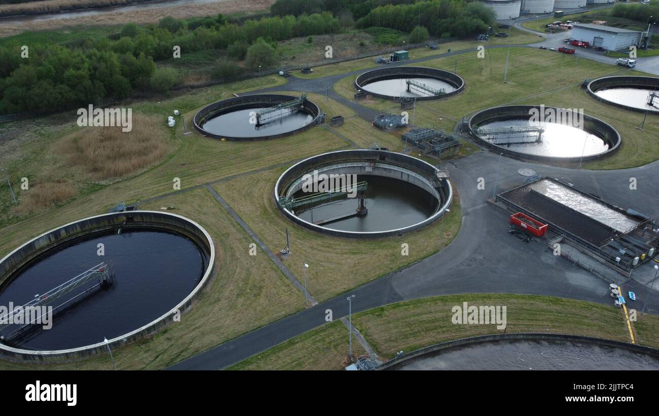 An aerial view of wastewater treatment plant with clarifiers for filtration of dirty water