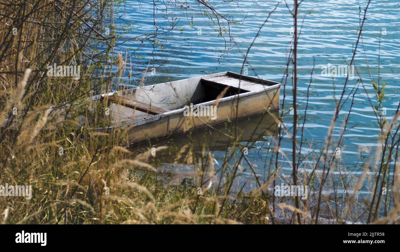 A little boat docked in a sandpit near Roudnice nad Labem Stock Photo