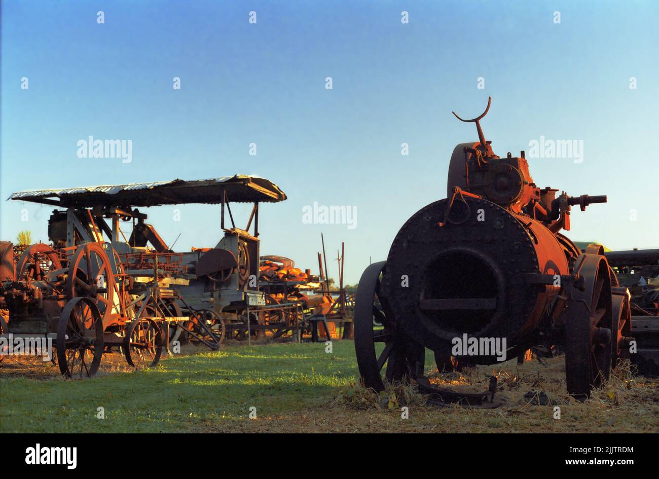 Rusting agricultural machinery in a scrapyard: Narromine, on the Mitchell Highway, New South Wales, Australia. Stock Photo