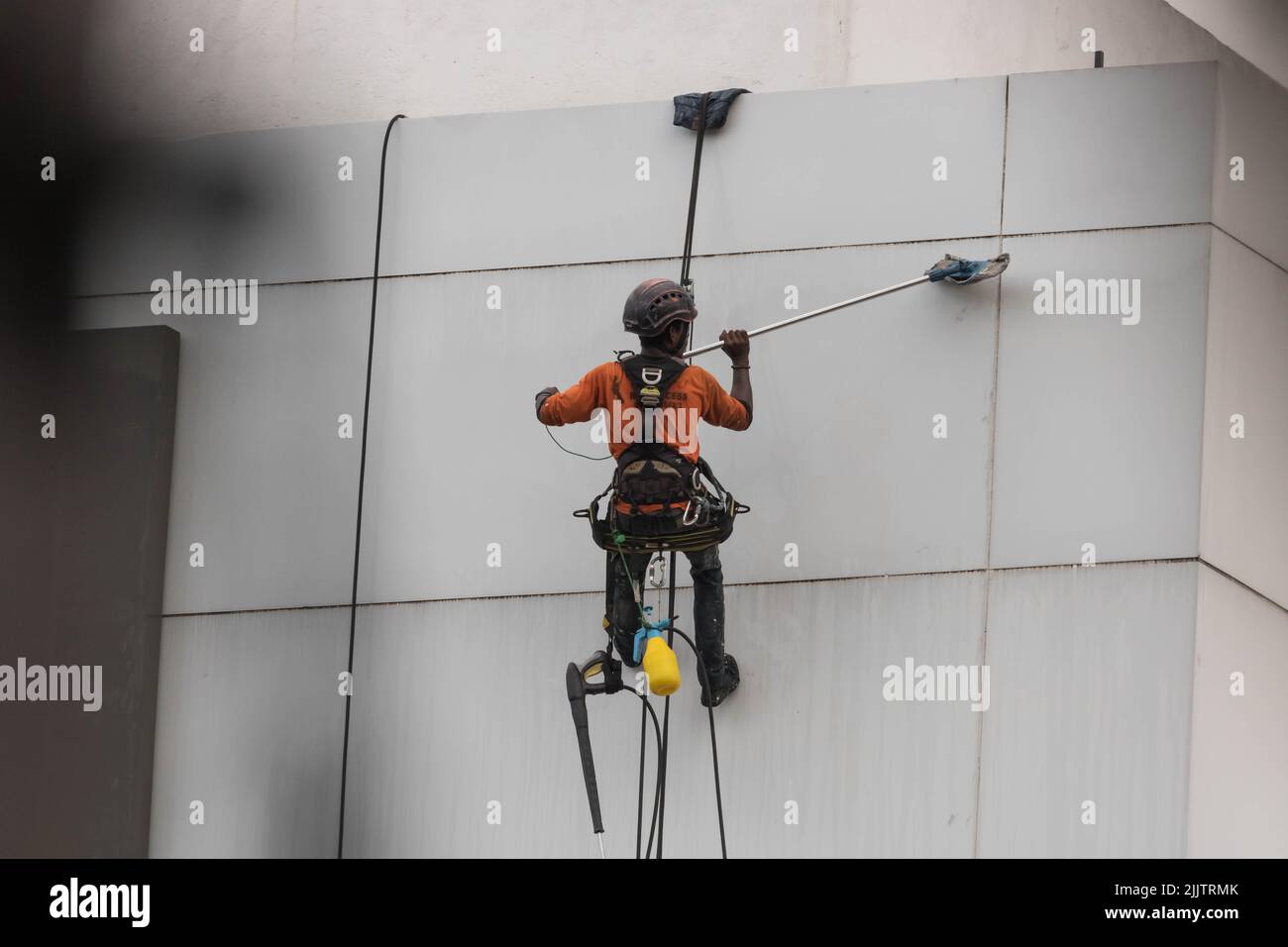 Men Cleaning a High-Rise Building Stock Photo