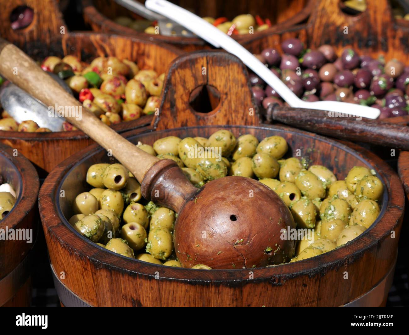 Bowls of olives for sale on a market stall Stock Photo