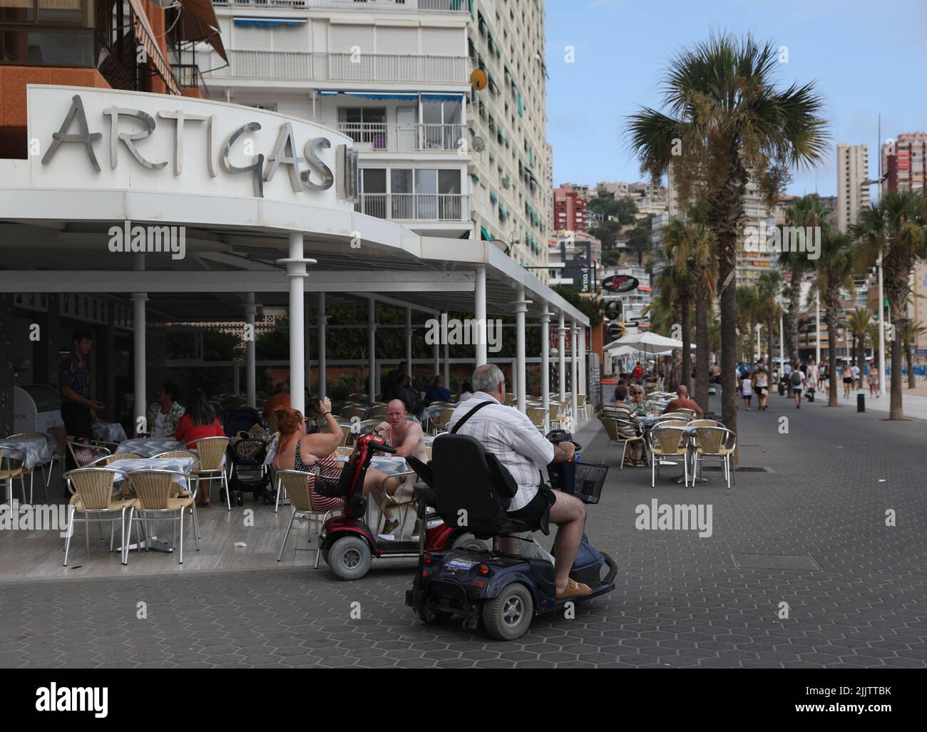 Benidorm, Spain. 27th July, 2022. Holidaymakers riding mobility