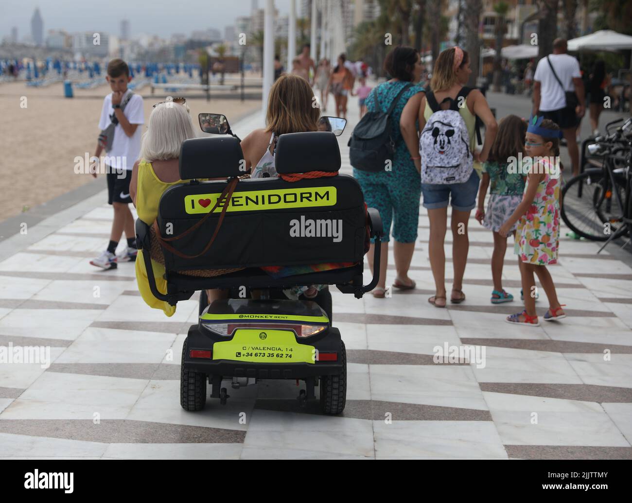 Benidorm, Spain. 27th July, 2022. Holidaymakers riding mobility