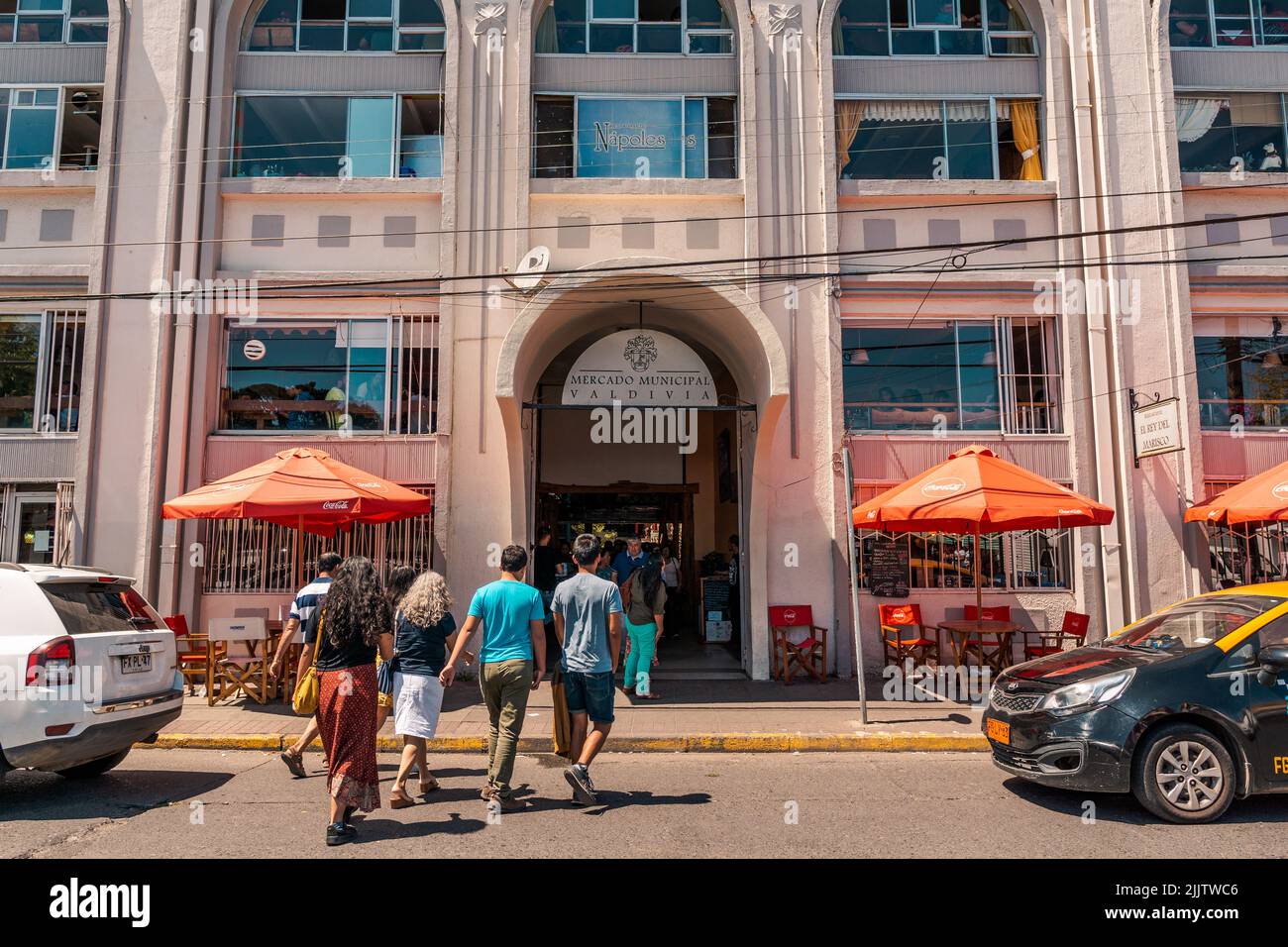 A beautiful shot of people going into Mercado Municipal of Valdivia, Chile on a sunny day Stock Photo