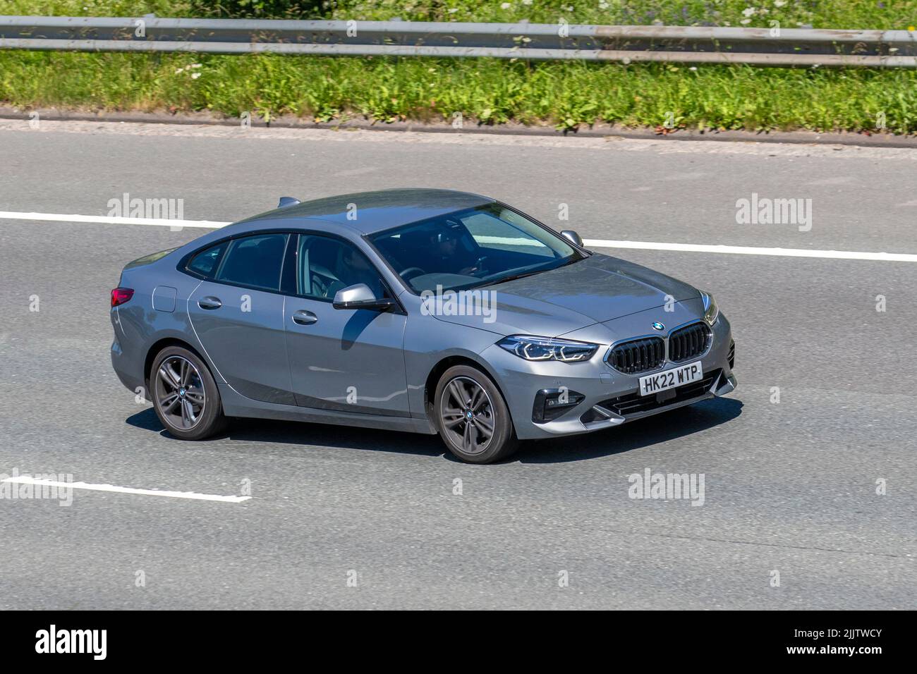 2022 218I Sport Auto Sport 136 DCT Auto Start/Stop S/S, 1499cc petrol saloon; Coupe traveling on the M6 motorway in Manchester, UK Stock Photo