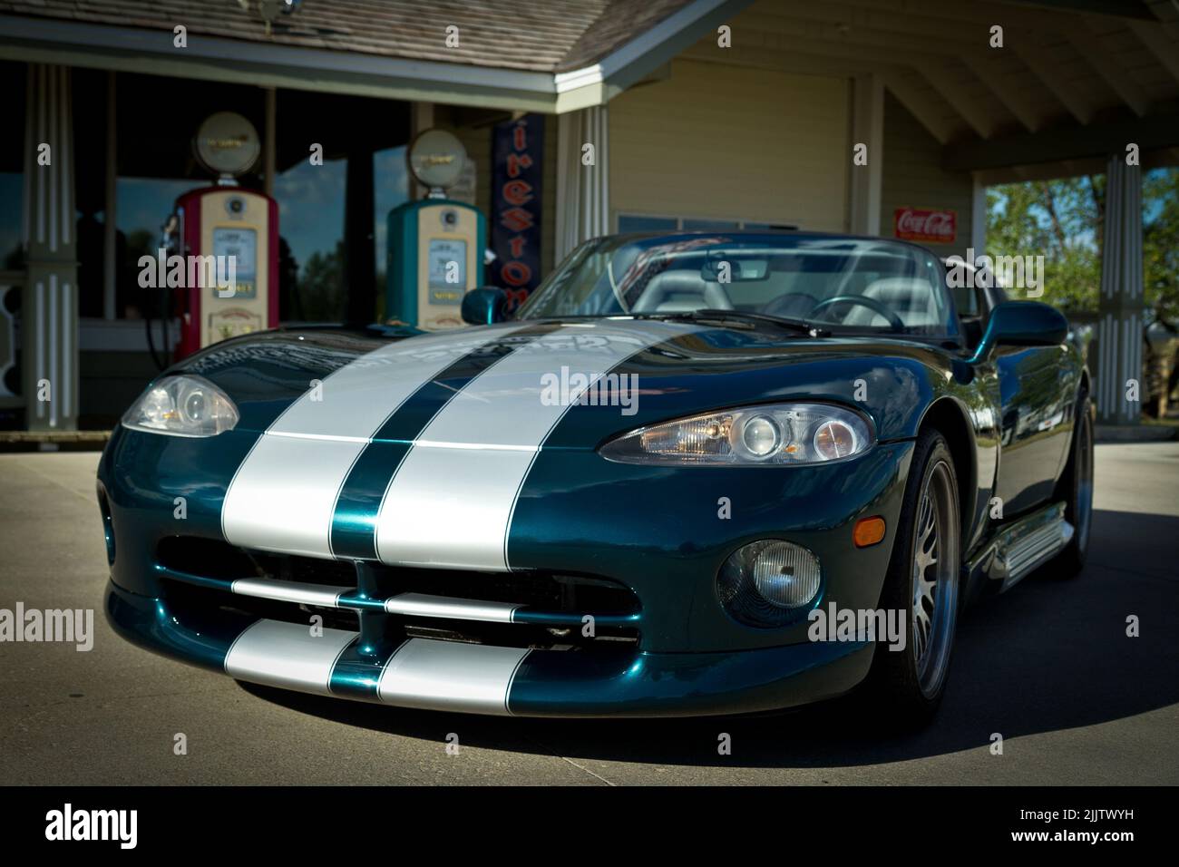 A beautiful photo of a Dodge Viper.Blue body with white stripe in front of a gas pump at Morden, Manitoba Stock Photo