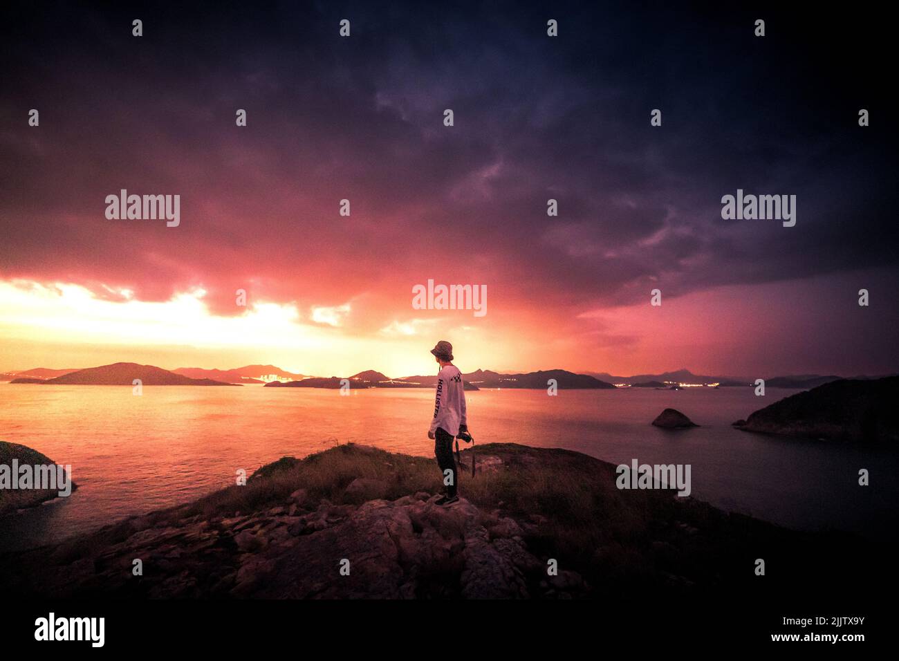 Hiker standing on mountain hi-res stock photography and images - Alamy