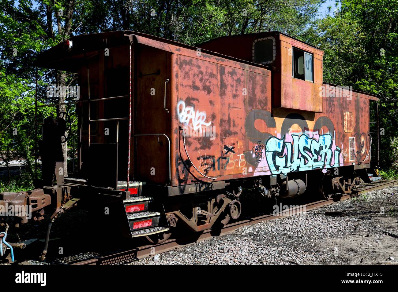A view of a caboose sitting outside of downtown Hastings, MN Stock Photo