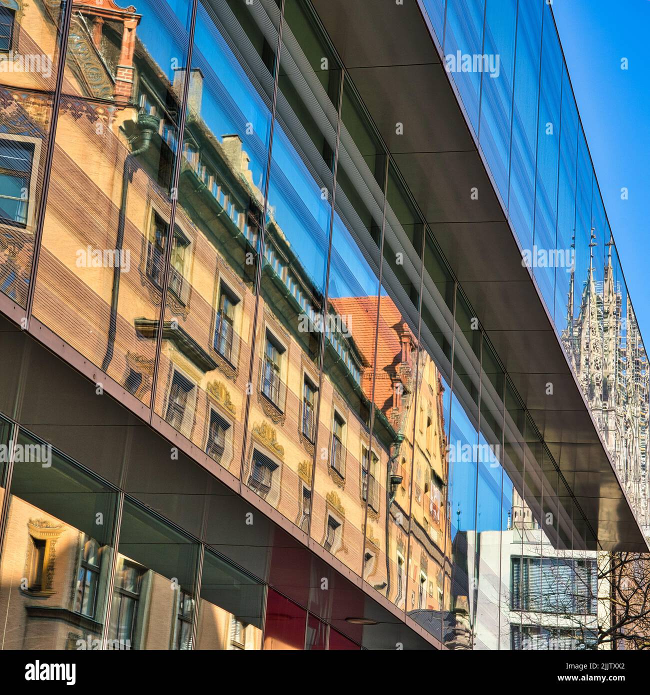 A vertical shot of an urban area with a modern building in Ulm City, Munster, Germany Stock Photo