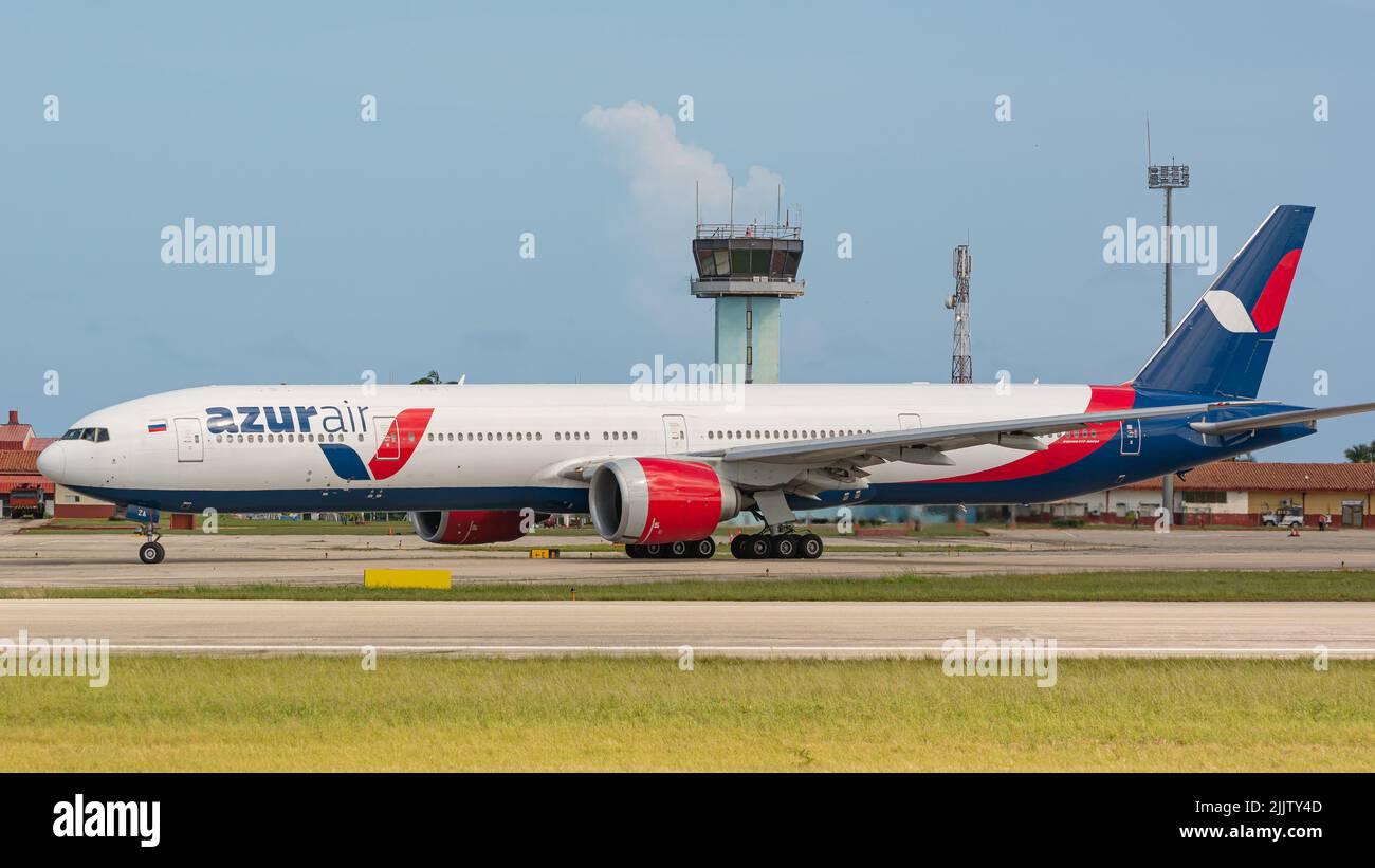 A Royal flight Boeing 777 airplane in Varadero Airport international with a blue sky in Matanzas