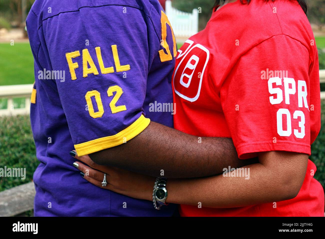 A male and female African Americans hugging each other from the Omega Psi Phi and Delta Signa Theta communities Stock Photo