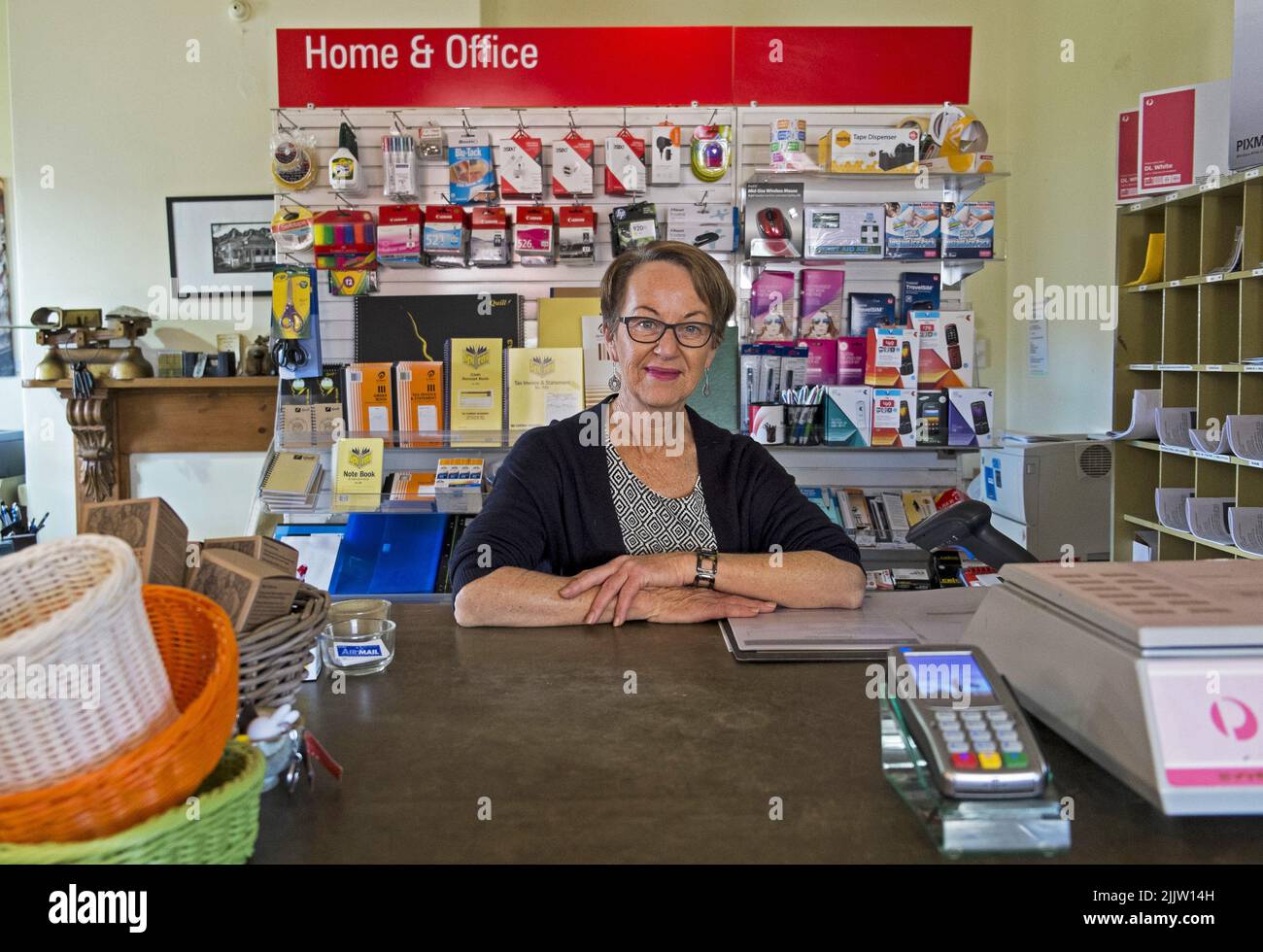 Clare Ryan, postmistress/postmaster of the small country post office in Balmoral in Western Victoria. Clare is a lifestyle changer who left a busy career in Sydney to find a quiter life in the country. She is an active member of her rural community. Stock Photo