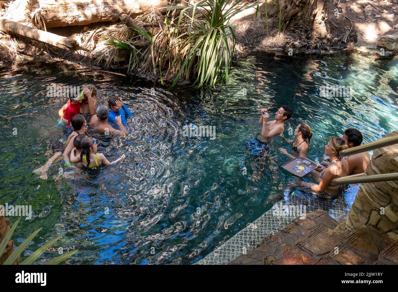 Tourists enjoying the warm waters of the thermal springs at Mataranka in the Northern Territory Stock Photo