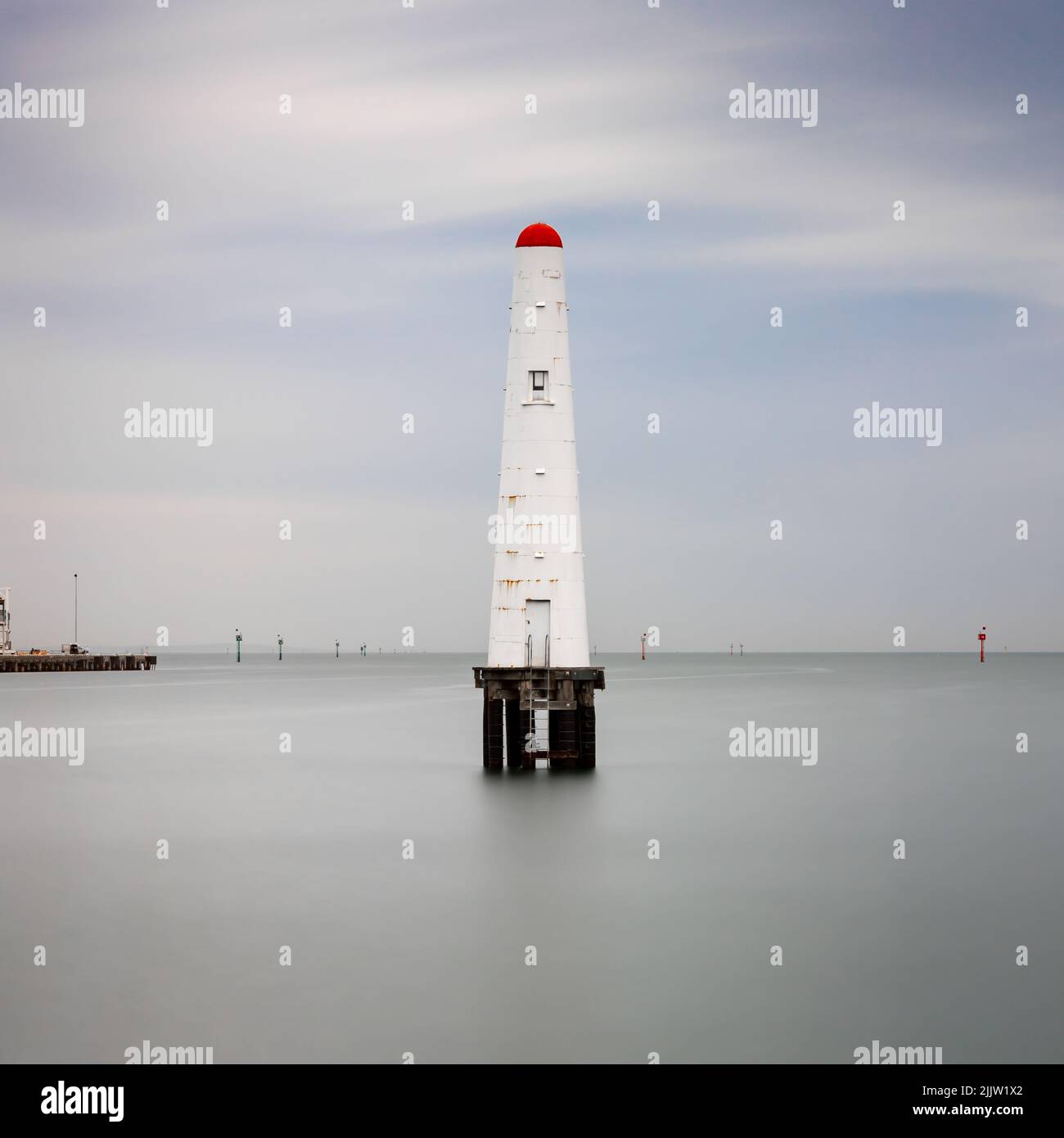 An old lighthouse in the water of Port Phillip Bay in Melbourne