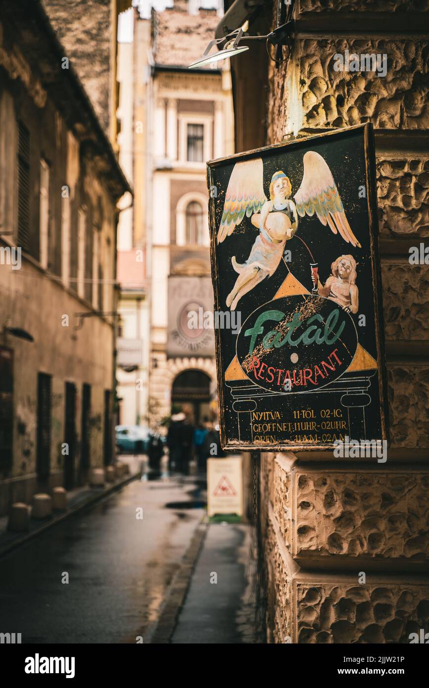 A vertical shot of a sign of the Fatal restaurant in the street of Budapest, Hungary Stock Photo