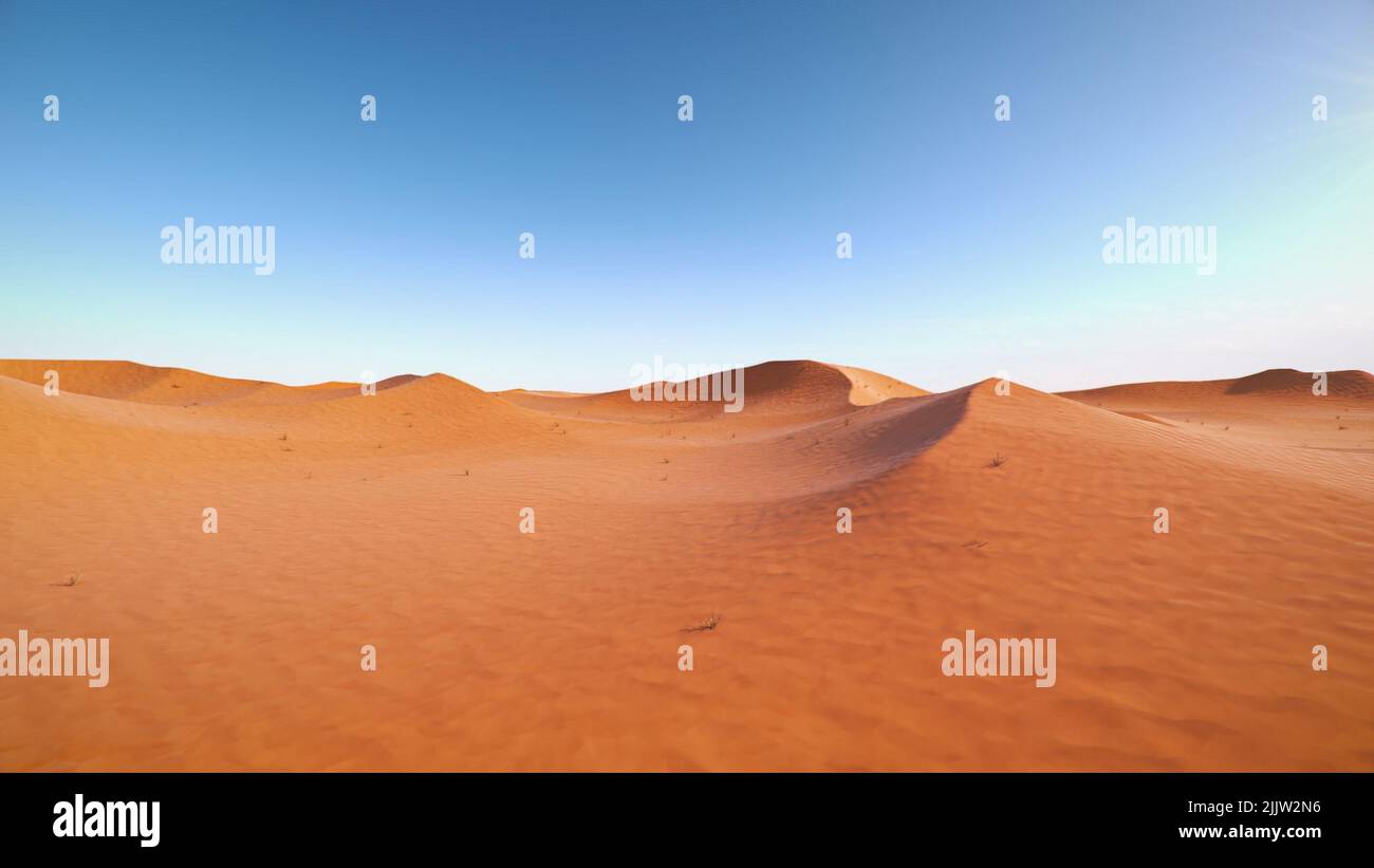 A panoramic shot of breathtaking view of sand dunes in a desert under a ...