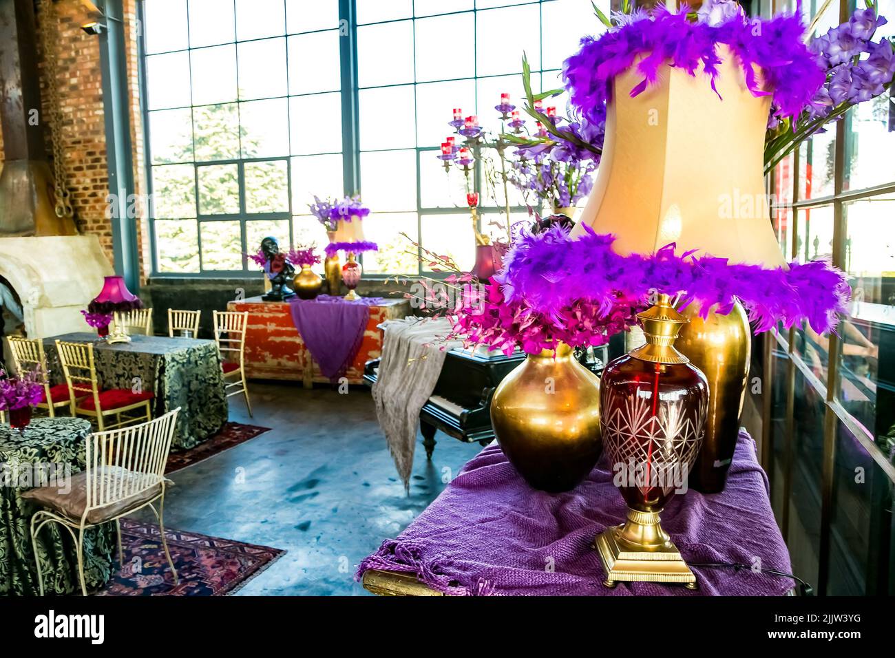 The Purple themed decor in the venue for the party event, at a large corporate gala dinner event