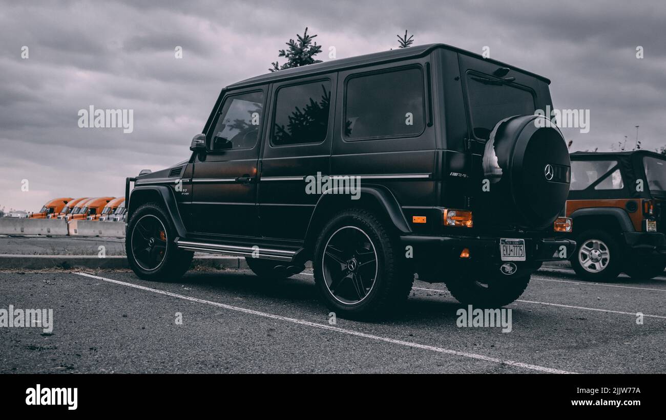 A close-up of G wagon Mercedes Benz car parked in the street Stock ...