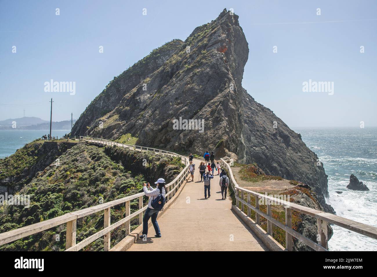 Path Point Ca A scenic view of tourists walking on the path to Point Bonita ...