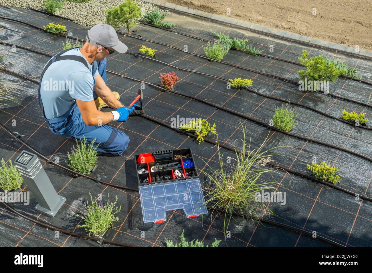 Professional Caucasian Landscaper in His 40s Installing Another Hose ...