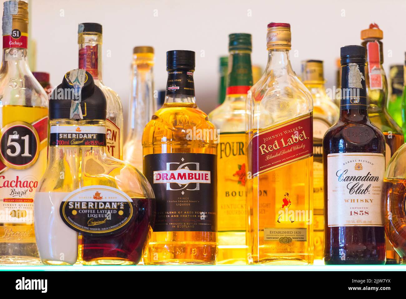 NAPLES - MAR 26: Shelf in a bar with strong alcohol beverages whiskey, rum, liqueur in Naples March 26, 2017 in Italy Stock Photo