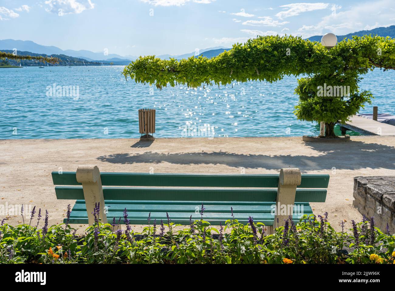 Bench in Front of the Worthersee in Poertschach, Carinthia, Austria Stock Photo