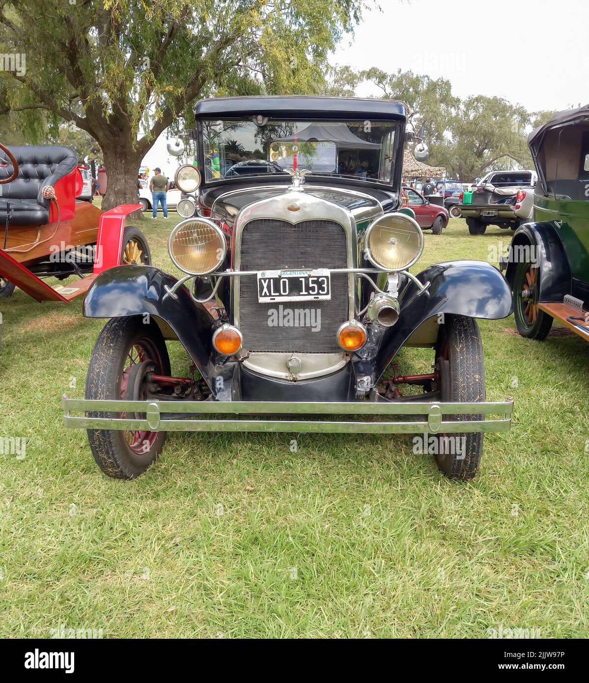 Old black Ford Model A Fordor sedan 1928 1931. Front view. Nature