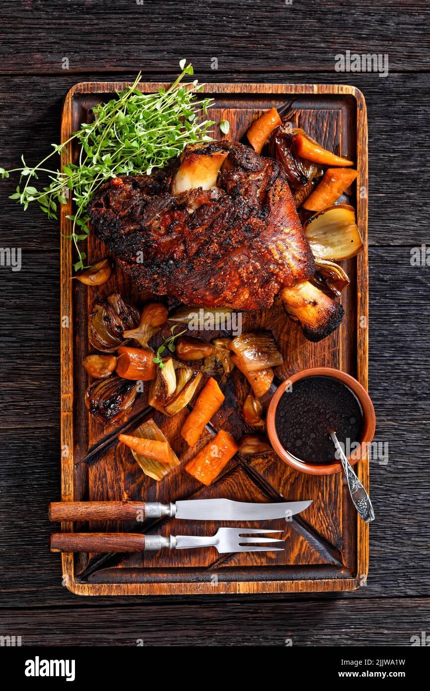 Crispy German Pork Knuckle, roast ham hock, Schweinshaxe, with Beer